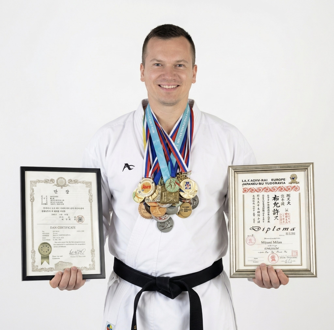 Coach Milan with championship medals and master diplomas